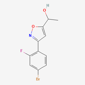 molecular formula C11H9BrFNO2 B8225261 1-[3-(4-Bromo-2-fluorophenyl)-1,2-oxazol-5-yl]ethanol 