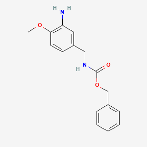 molecular formula C16H18N2O3 B8231543 benzyl N-[(3-amino-4-methoxyphenyl)methyl]carbamate 