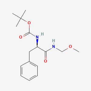 molecular formula C16H24N2O4 B8235094 Carbamic acid, N-[(1R)-2-(methoxymethylamino)-2-oxo-1-(phenylmethyl)ethyl]-, 1,1-dimethylethyl ester 
