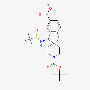 molecular formula C23H34N2O5S B8237358 (3S)-3-[[(R)-tert-butylsulfinyl]amino]-1'-[(2-methylpropan-2-yl)oxycarbonyl]spiro[1,3-dihydroindene-2,4'-piperidine]-5-carboxylic acid 