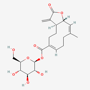 molecular formula C21H28O9 B8255256 beta-D-Glucopyranose, 1-[(3aS,6Z,10E,11aR)-2,3,3a,4,5,8,9,11a-octahydro-10-methyl-3-methylene-2-oxocyclodeca[b]furan-6-carboxylate] 