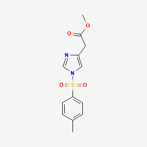molecular formula C13H14N2O4S B8266514 Methyl 2-(1-tosyl-1H-imidazol-4-YL)acetate CAS No. 497159-97-4