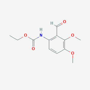 molecular formula C12H15NO5 B8280511 2-(N-Carbethoxyamino)-5,6-dimethoxybenzaldehyde 