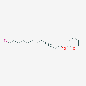 2-[(12-Fluorododec-3-YN-1-YL)oxy]oxane