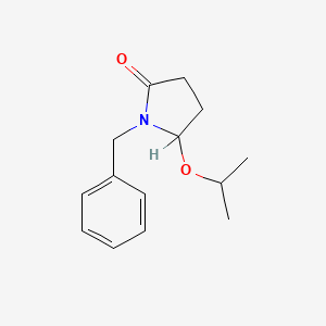 molecular formula C14H19NO2 B8297906 (+-)-5-(1-Methylethoxy)-1-(phenylmethyl)-2-pyrrolidinone CAS No. 136410-29-2