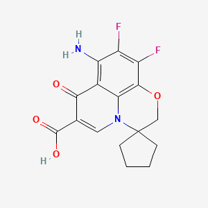 molecular formula C16H14F2N2O4 B8311885 8'-Amino-9',10'-difluoro-7'-oxo-2'H,7'H-spiro[cyclopentane-1,3'-[1,4]oxazino[2,3,4-IJ]quinoline]-6'-carboxylic acid 