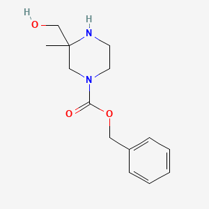 molecular formula C14H20N2O3 B8312366 Racemic benzyl 3-(hydroxymethyl)-3-methylpiperazine-1-carboxylate 