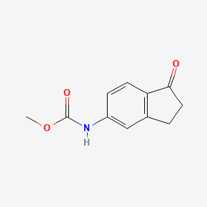 molecular formula C11H11NO3 B8334765 (1-Oxo-indan-5-yl)-carbamic acid methyl ester 