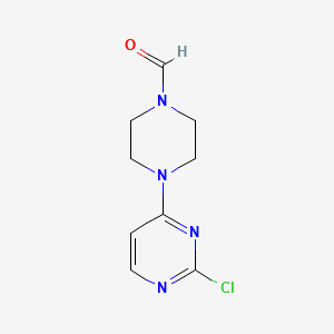 molecular formula C9H11ClN4O B8345574 2-Chloro-4-(4-formylpiperazino)pyrimidine 