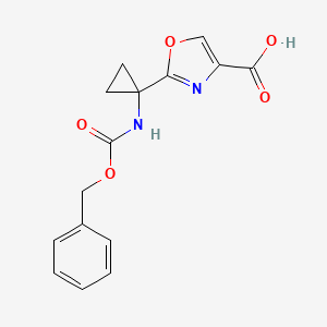 molecular formula C15H14N2O5 B8346919 2-(1-Benzyloxycarbonylamino-cyclopropyl)-oxazole-4-carboxylic acid 