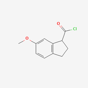 B8371115 6-Methoxy-indane-1-carboxylic acid chloride CAS No. 108048-43-7