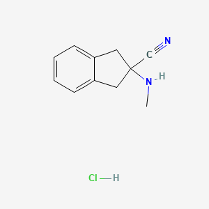 molecular formula C11H13ClN2 B8378139 2-(Methylamino)indane-2-carbonitrile hydrochloride 