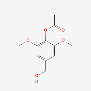 molecular formula C11H14O5 B8392630 Acetic acid 4-hydroxymethyl-2,6-dimethoxy-phenyl ester 