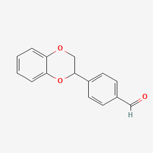 molecular formula C15H12O3 B8403414 (+/-)-4-(2,3-Dihydro-benzo[1,4]dioxin-2-yl)-benzaldehyde 