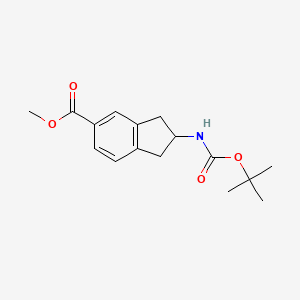 molecular formula C16H21NO4 B8403631 2-(Tert-butoxycarbonylamino)-5-methoxycarbonylindan 