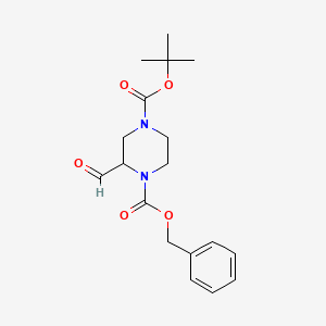 1-Benzyl 4-tert-butyl 2-formylpiperazine-1,4-dicarboxylate