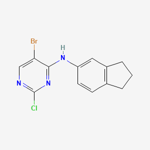 molecular formula C13H11BrClN3 B8454369 5-Bromo-2-chloro-4-(indan-5-ylamino)pyrimidine 
