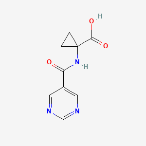molecular formula C9H9N3O3 B8454481 1-[(Pyrimidine-5-carbonyl)-amino]cyclopropanecarboxylic acid 