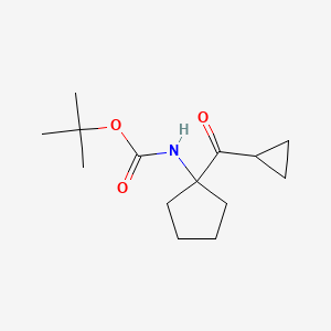 molecular formula C14H23NO3 B8500054 (1-Cyclopropanecarbonyl-cyclopentyl)-carbamic acid tert-butyl ester 