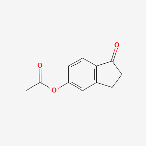 molecular formula C11H10O3 B8527923 Acetic acid 1-oxo-indan-5-yl ester 