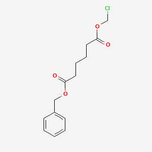 B8549623 Hexanedioic acid, chloromethyl phenylmethyl ester CAS No. 87343-30-4