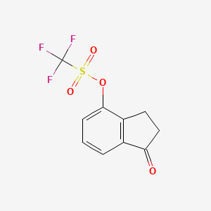 molecular formula C10H7F3O4S B8594686 1-oxo-2,3-dihydro-1H-inden-4-yl trifluoromethanesulfonate CAS No. 177735-47-6
