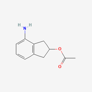4-amino-2,3-dihydro-1H-inden-2-yl acetate