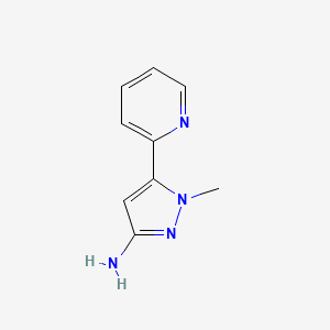 molecular formula C9H10N4 B8611099 1-Methyl-5-pyridin-2-yl-1H-pyrazole-3-ylamine 