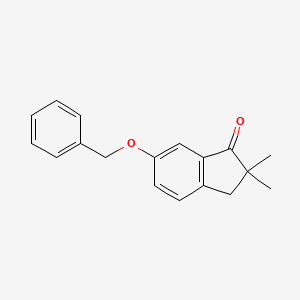 molecular formula C18H18O2 B8625623 6-(Benzyloxy)-2,2-dimethyl-2,3-dihydroinden-1-one 