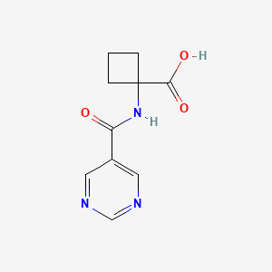 molecular formula C10H11N3O3 B8652647 1-[(Pyrimidin-5-ylcarbonyl)-amino]cyclobutanecarboxylic acid 