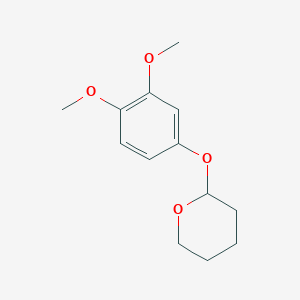 B8653378 2-(3,4-Dimethoxyphenoxy)oxane CAS No. 66967-25-7