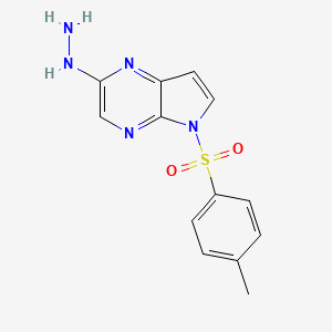 [5-(4-methylphenyl)sulfonylpyrrolo[2,3-b]pyrazin-2-yl]hydrazine