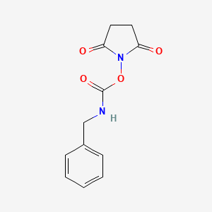 molecular formula C12H12N2O4 B8662946 1-[(Benzylcarbamoyl)oxy]pyrrolidine-2,5-dione CAS No. 88692-20-0