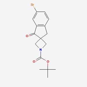 molecular formula C16H18BrNO3 B8689516 Spiro[azetidine-3,2'-[2H]indene]-1-carboxylic acid, 6'-bromo-1',3'-dihydro-1'-oxo-, 1,1-dimethylethyl ester 