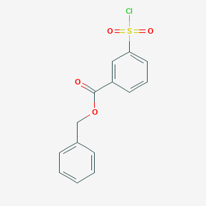 molecular formula C14H11ClO4S B8711065 Benzyl 3-(chlorosulfonyl)benzoate 