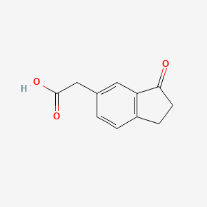 B8743700 5-Indanacetic acid, 3-oxo- CAS No. 71823-52-4