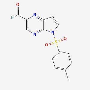 molecular formula C14H11N3O3S B8745928 5-tosyl-5H-pyrrolo[2,3-b]pyrazine-2-carbaldehyde 