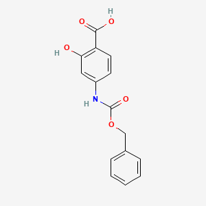 molecular formula C15H13NO5 B8765528 4-{[(Benzyloxy)carbonyl]amino}-2-hydroxybenzoic acid CAS No. 6935-15-5