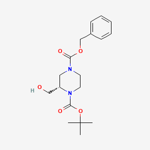 4-Benzyl 1-tert-butyl (2S)-2-(hydroxymethyl)piperazine-1,4-dicarboxylate