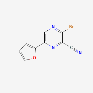 molecular formula C9H4BrN3O B8797595 3-Bromo-6-(furan-2-yl)pyrazine-2-carbonitrile 