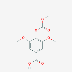 B099487 4-Ethoxycarbonyloxy-3,5-dimethoxybenzoic acid CAS No. 18780-67-1